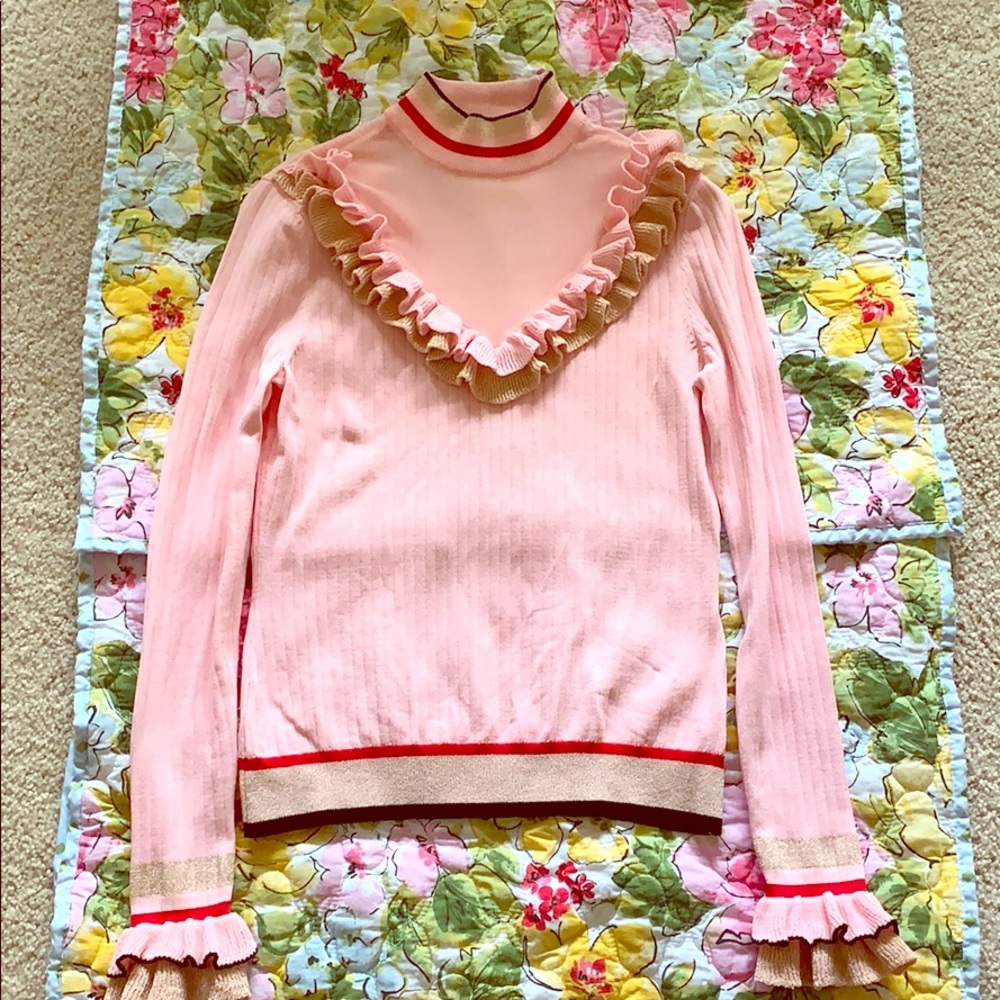 Pink mock neck dressy shirt.